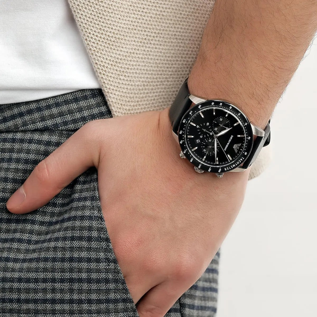Close-up wrist shot of Emporio Armani AR11243 with black leather strap and dial