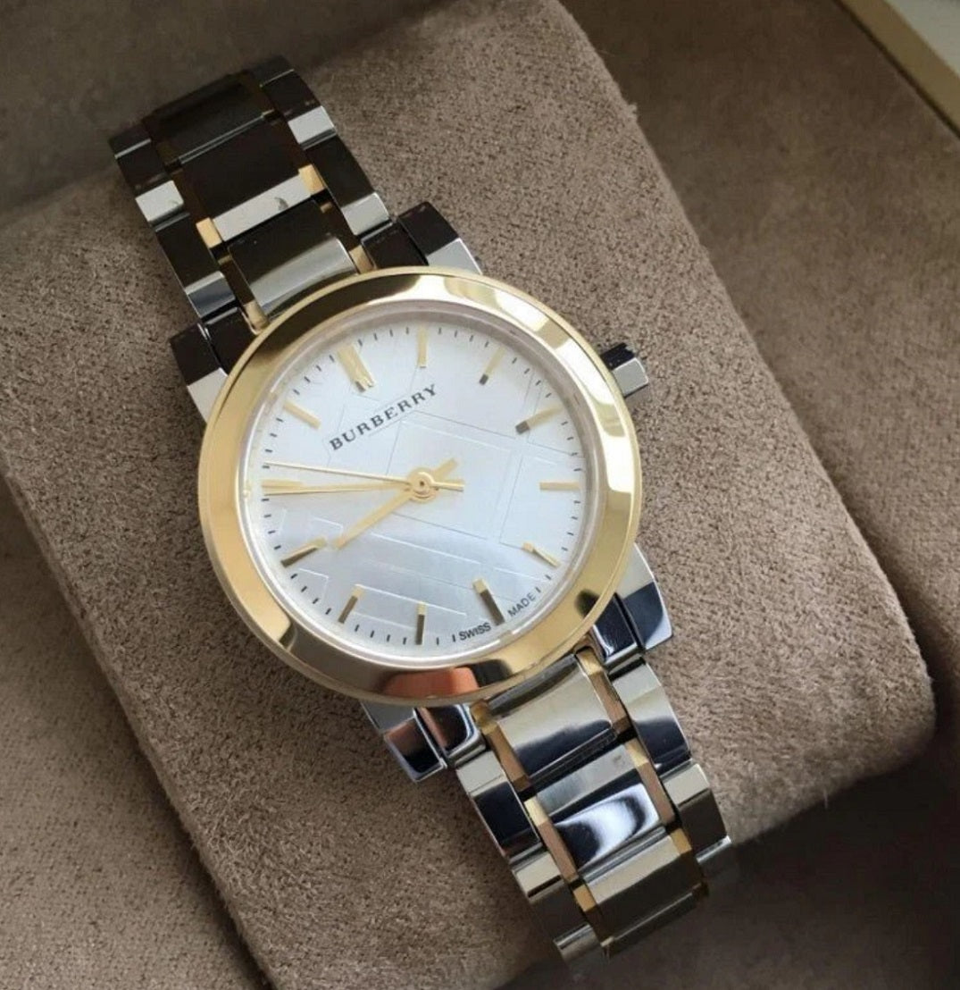 Burberry BU9217 two-tone watch displayed on its original watch pillow.