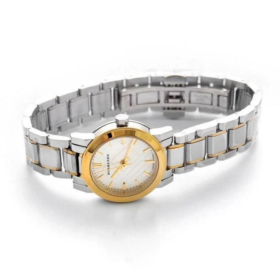 orizontal view of the Burberry BU9217 two-tone watch laying flat with the strap unbuckled.
