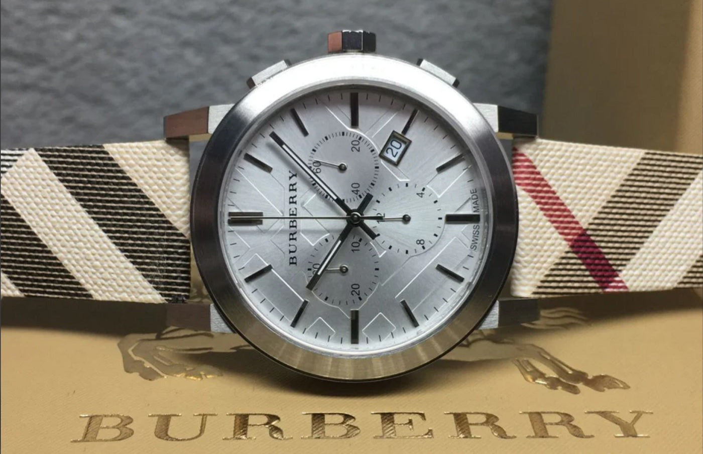 Close-up of silver dial on Burberry BU9357 men’s watch with signature check detailing