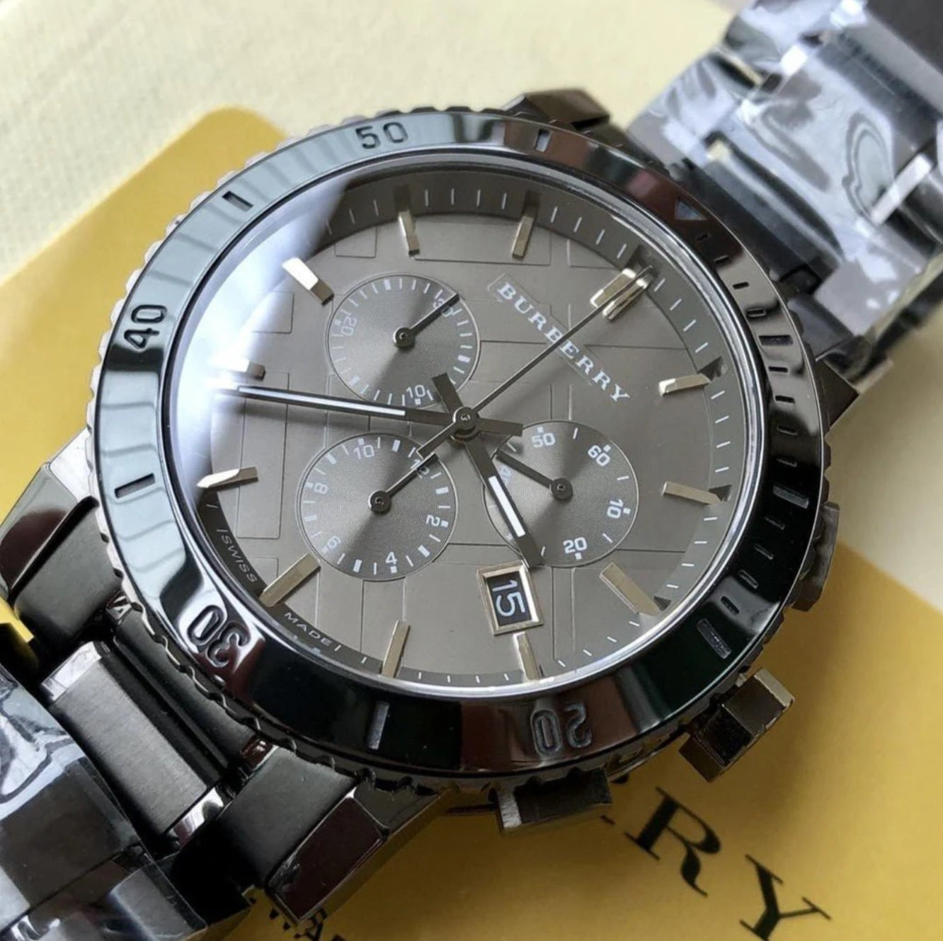 Detailed view of Burberry BU9381 men’s watch showcasing its minimalist grey dial