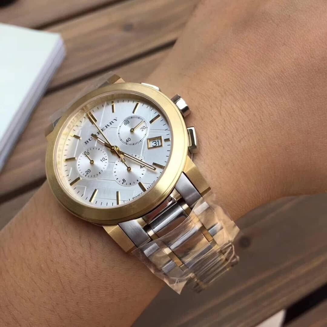 Burberry BU9751 unisex watch on wrist with silver and gold strap