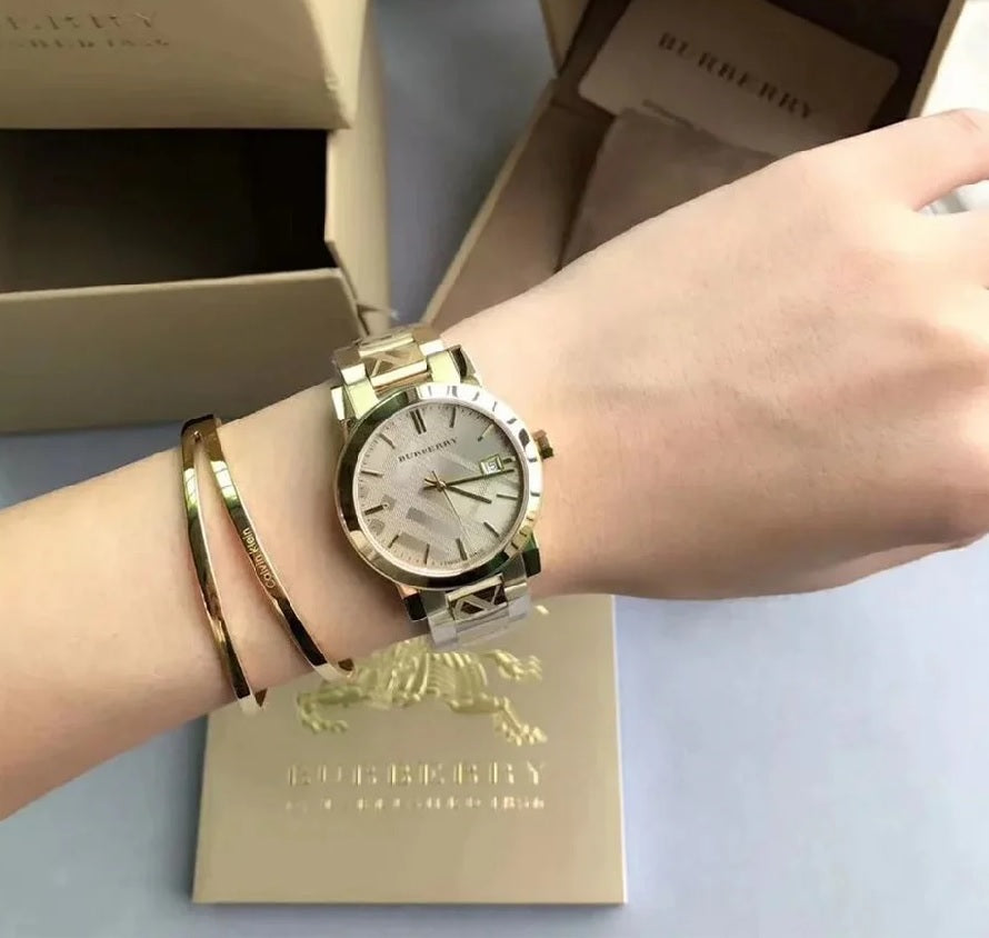 Burberry BU9033 gold unisex watch on wrist – The City 1 series