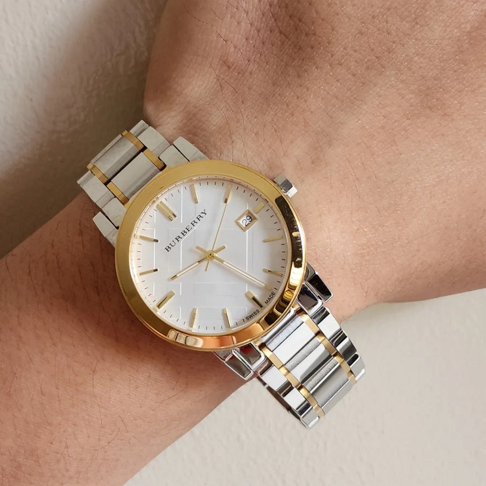 Burberry BU9115 silver and gold women’s watch shown on wrist in natural daylight