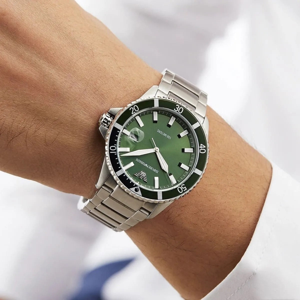 Close-up wrist shot of Emporio Armani AR11338 showcasing green dial and bold diver style