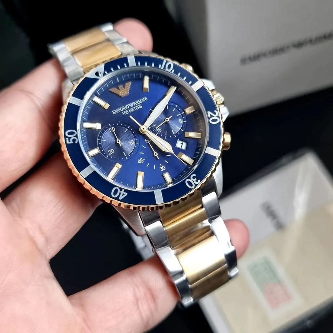 Close-up of deep blue dial on Emporio Armani AR11362 with luminous diver indices