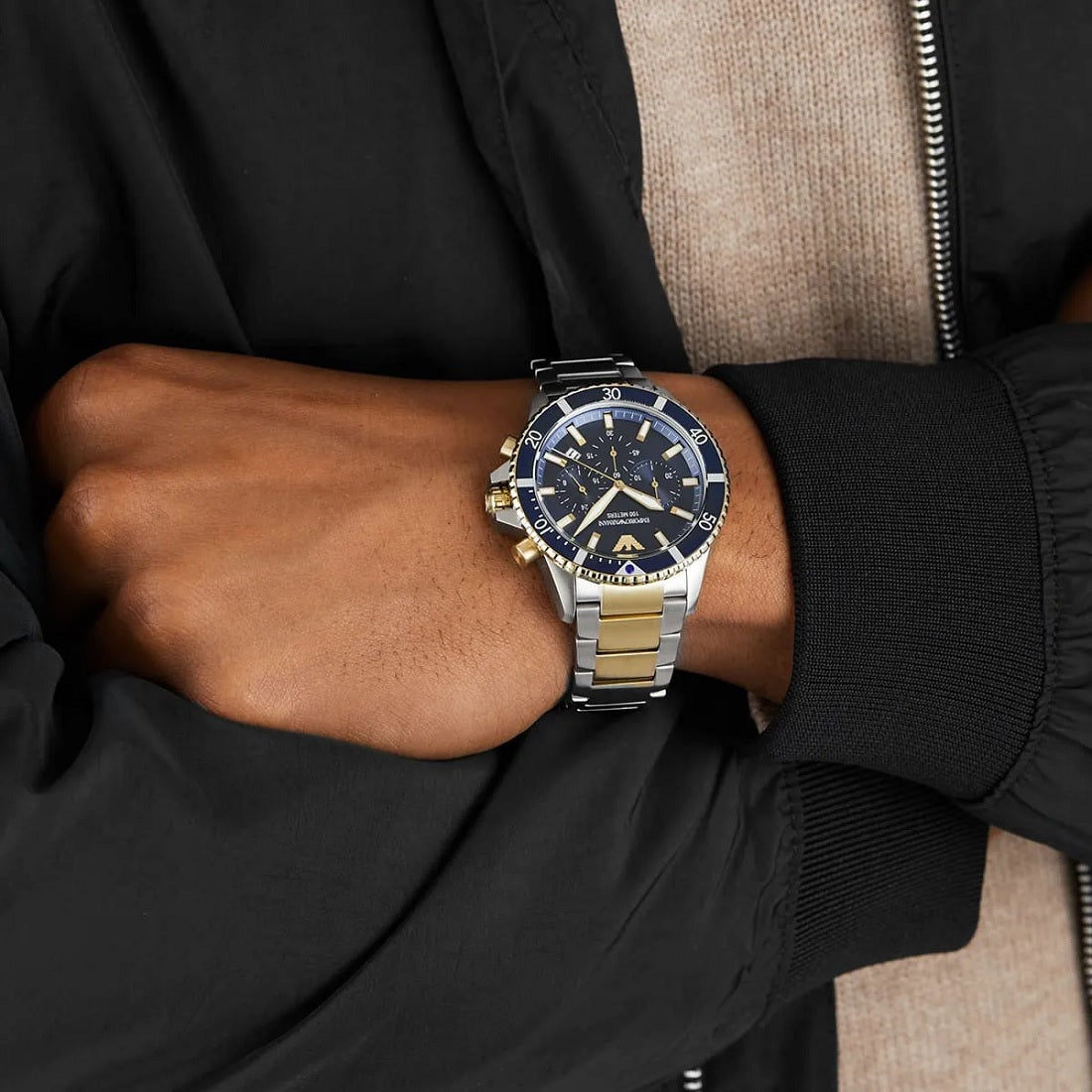 Emporio Armani AR11362 diver watch with blue dial and gold-tone accents worn on wrist