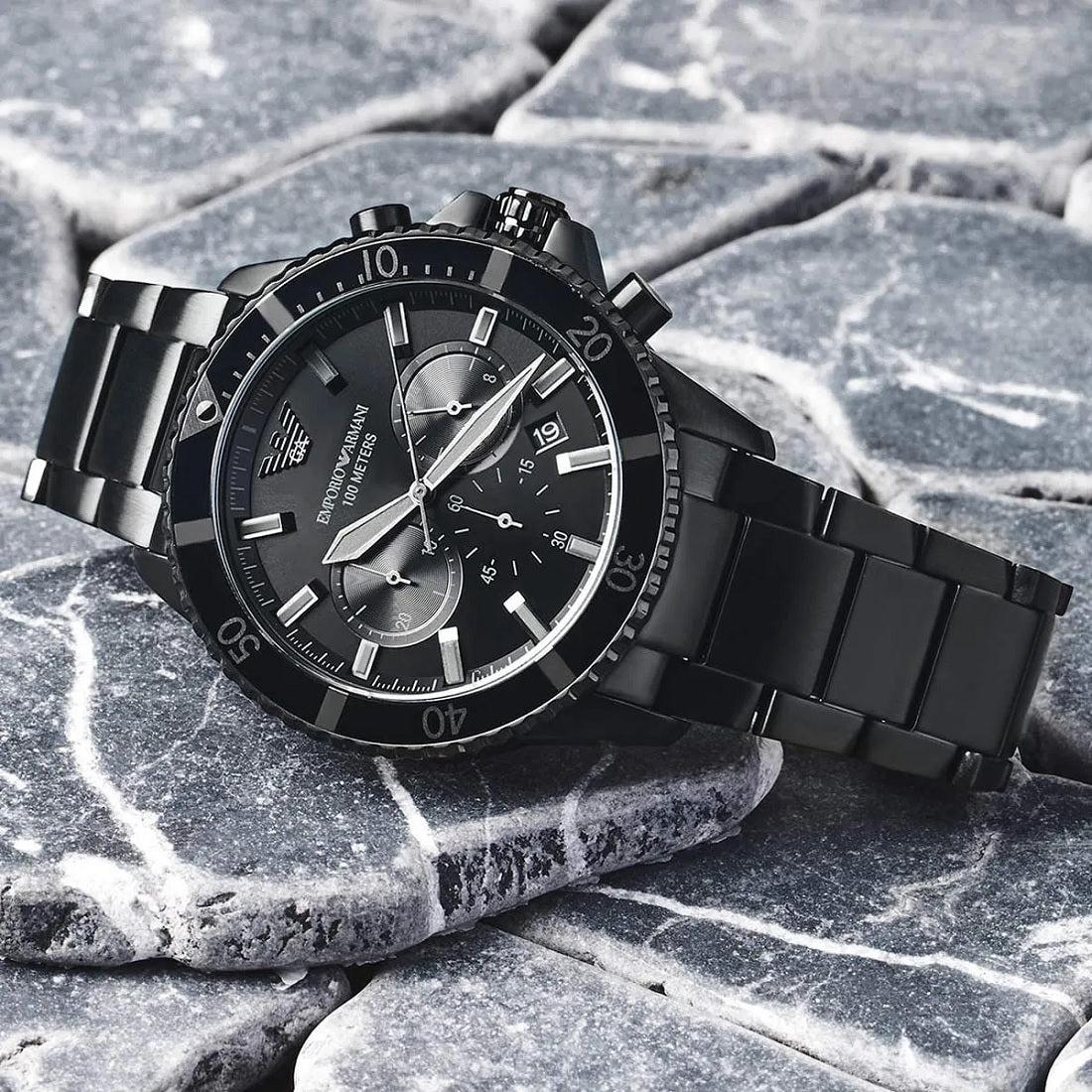 Angled view of Emporio Armani AR11363 with diver bezel and black strap