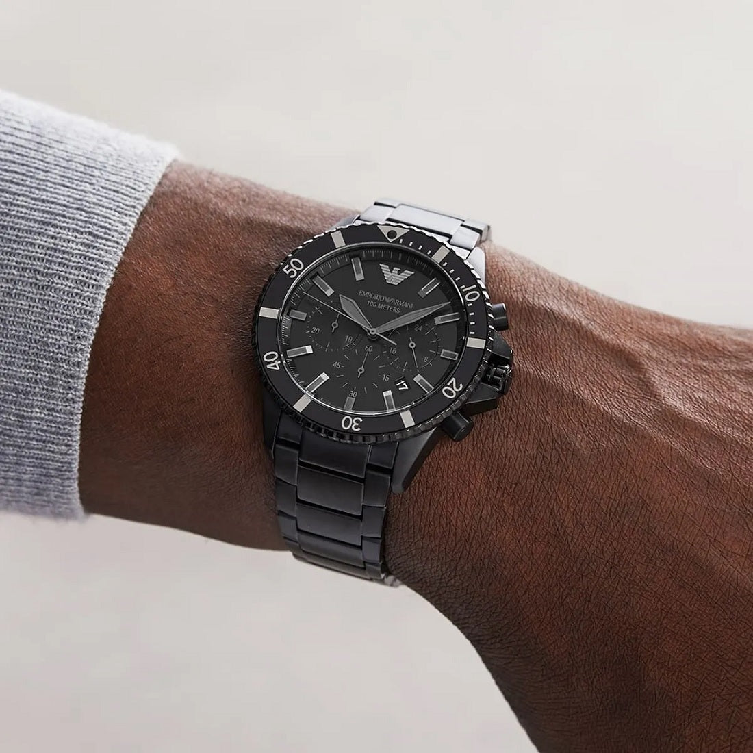 Emporio Armani AR11363 worn on wrist, showcasing its rugged black strap and dial