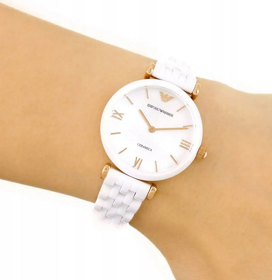 Emporio Armani AR1486 women’s white ceramic watch worn on wrist