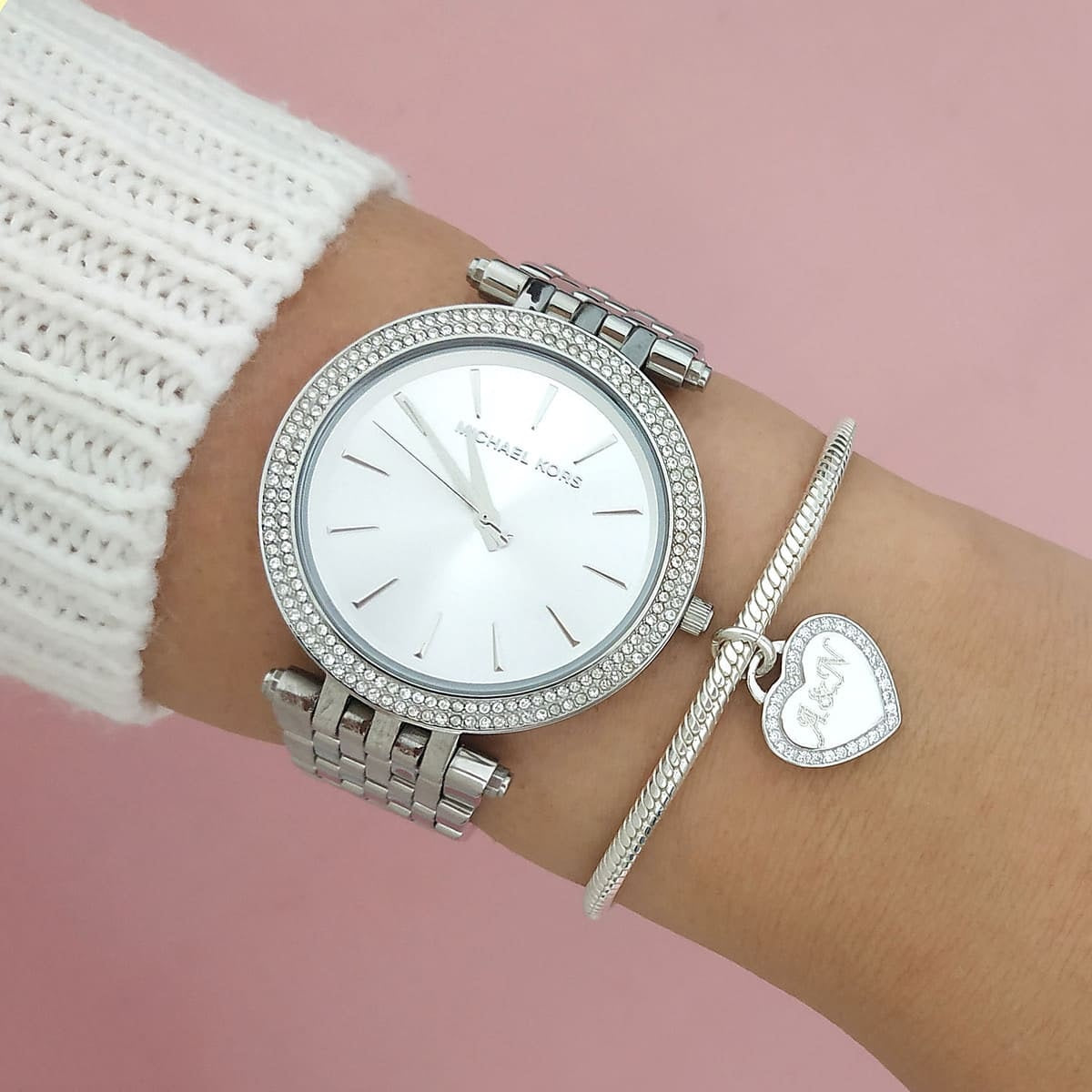 Close-up view of silver dial on Michael Kors MK3190 women’s watch on wrist
