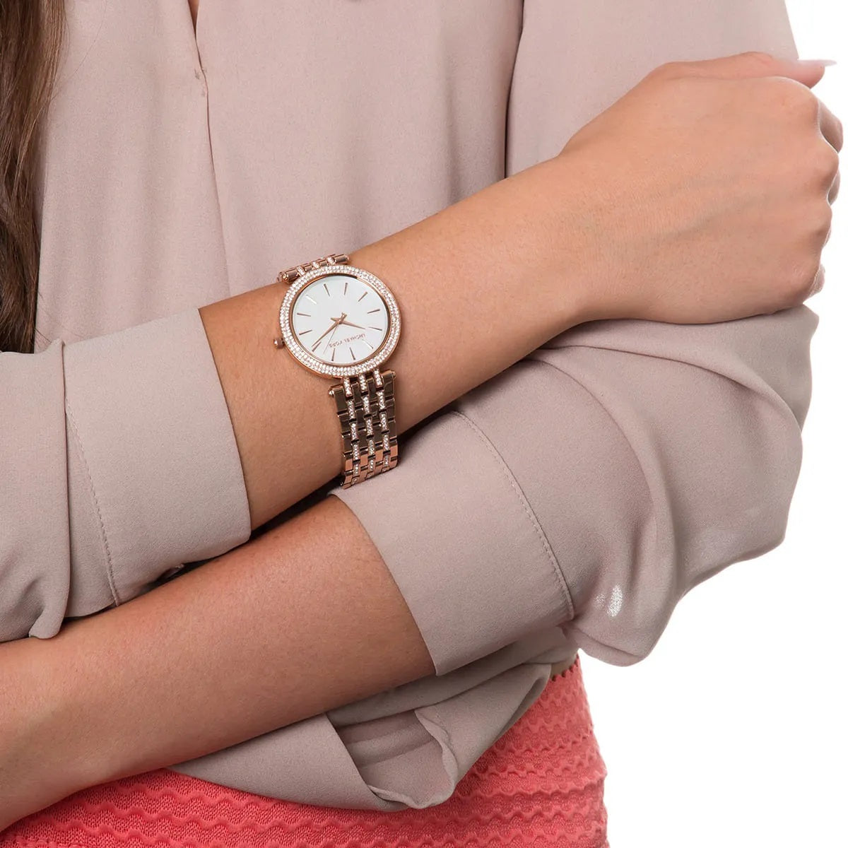 Glamour shot of Michael Kors MK3220 women’s watch with mother of pearl dial and sparkling crystals under soft lighting