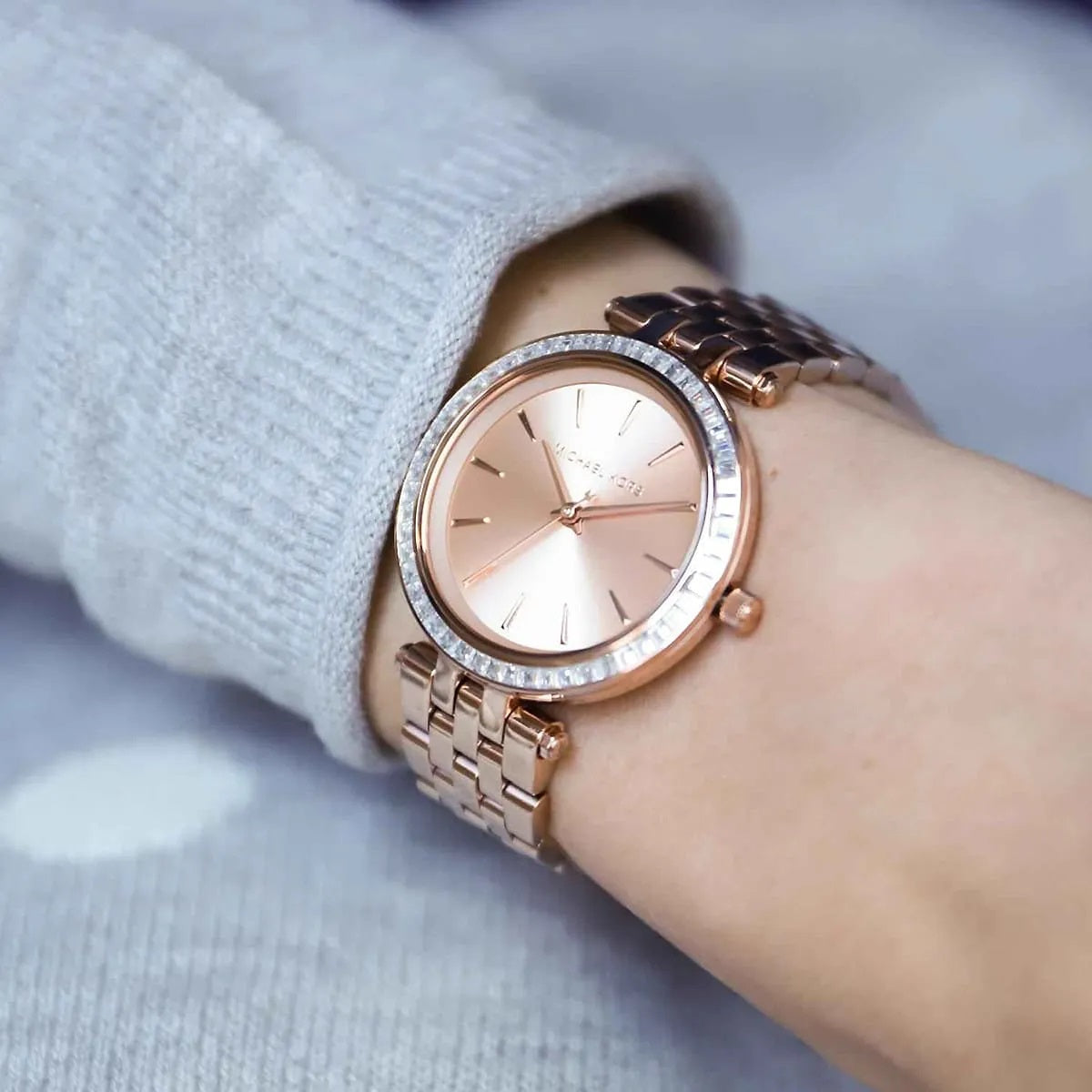 Close-up wrist shot of Michael Kors MK3366 highlighting its rose gold dial with crystal details