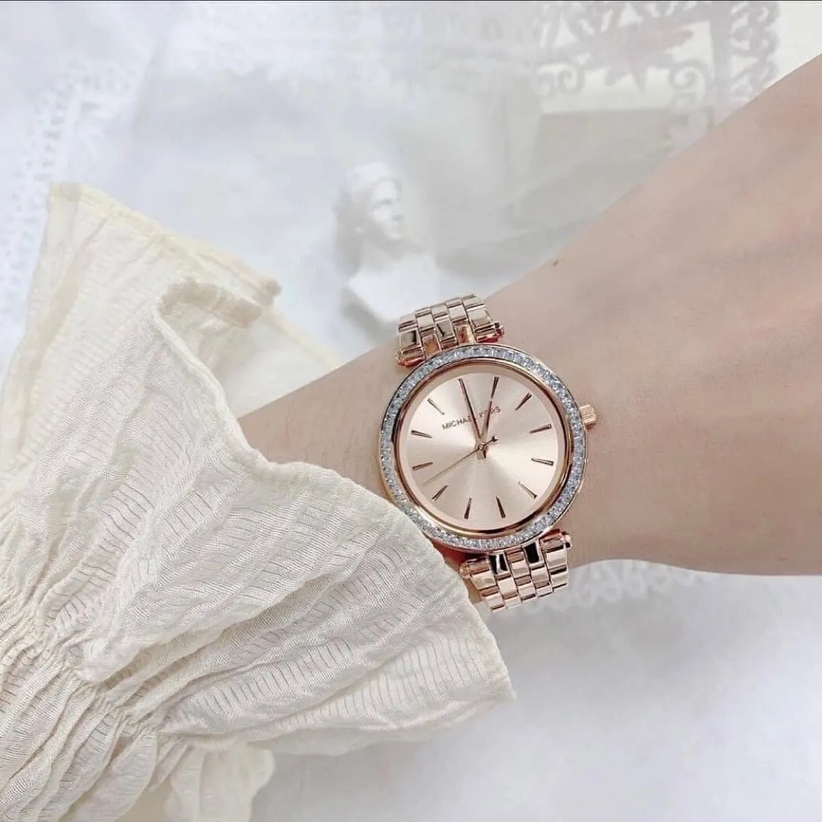 Wrist shot of Michael Kors MK3366, showing the full rose gold strap and dazzling crystals