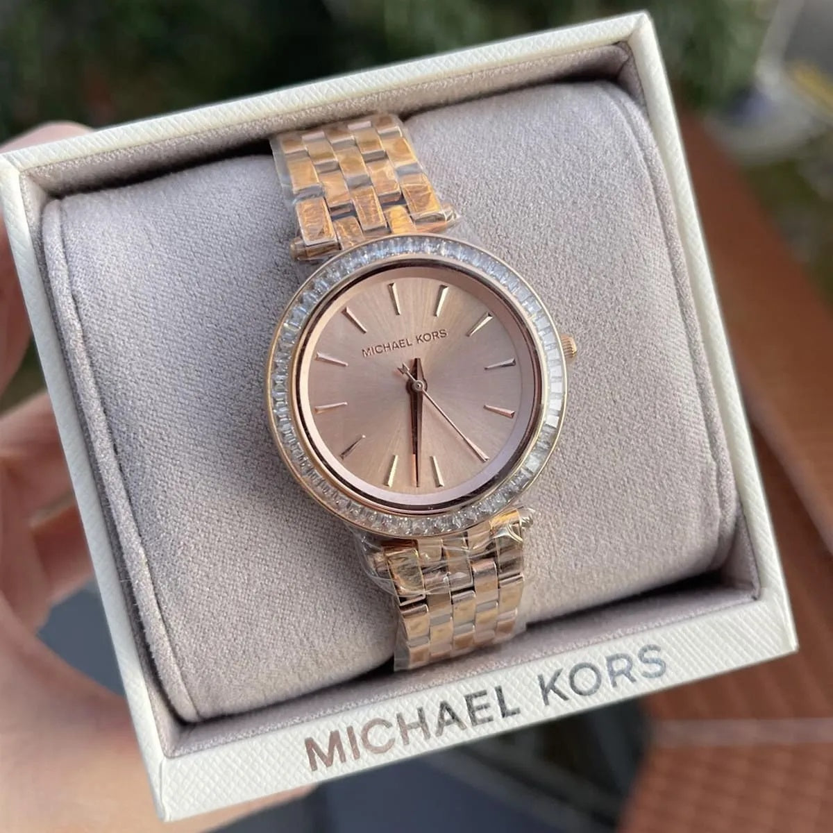 Michael Kors MK3366 displayed in box on pillow, showing off its rose gold dial and crystal accents