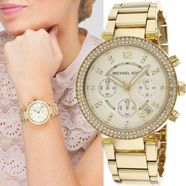 Michael Kors MK5354 women's gold watch worn on wrist showing full case and bracelet