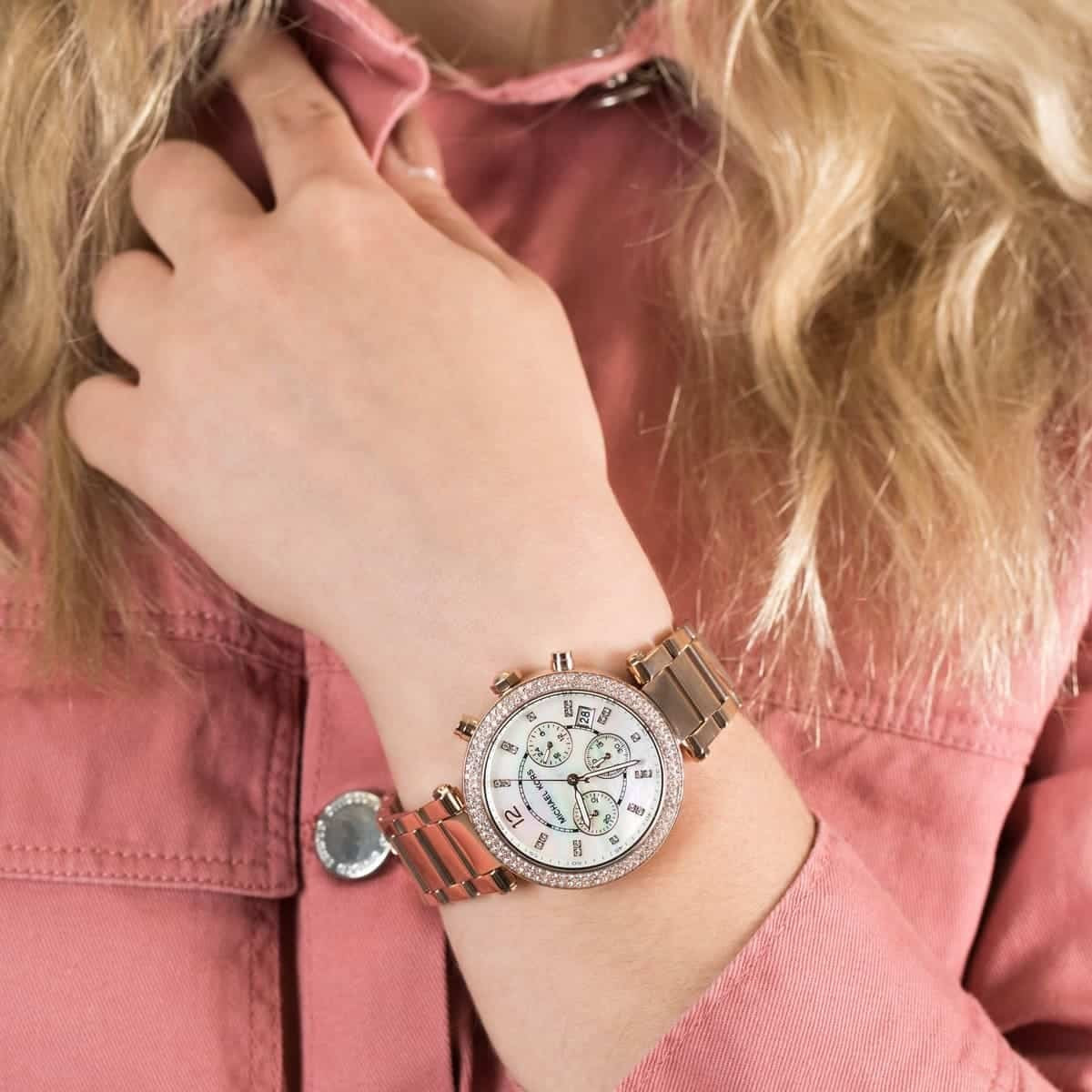 Michael Kors MK5491 rose gold women's watch worn on wrist with mother of pearl dial visible