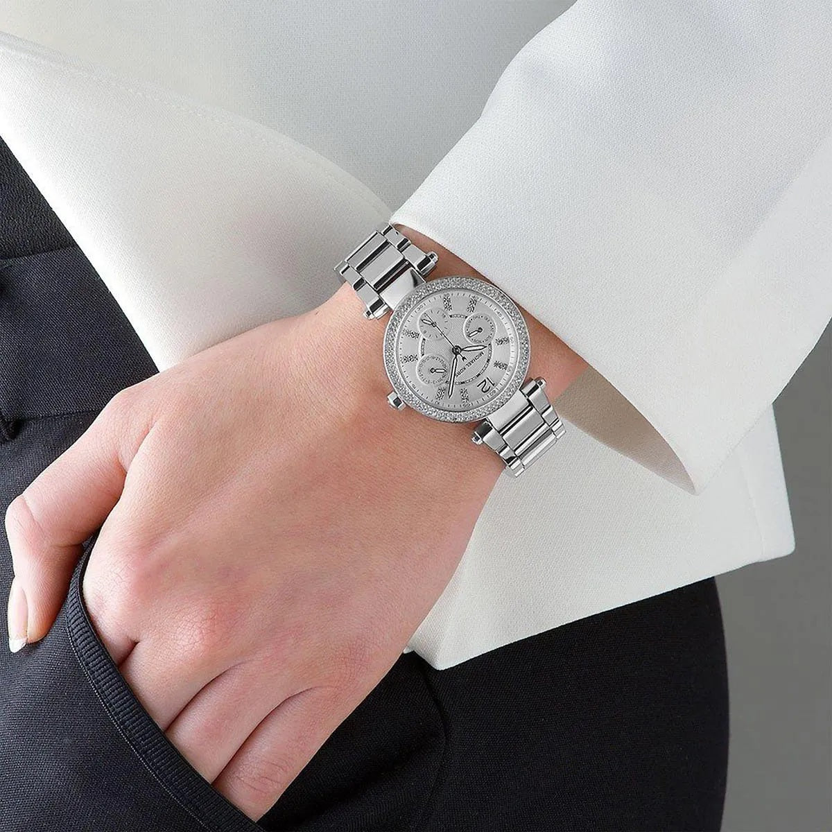 Close-up on wrist view of Michael Kors MK5615 with silver dial and matching strap