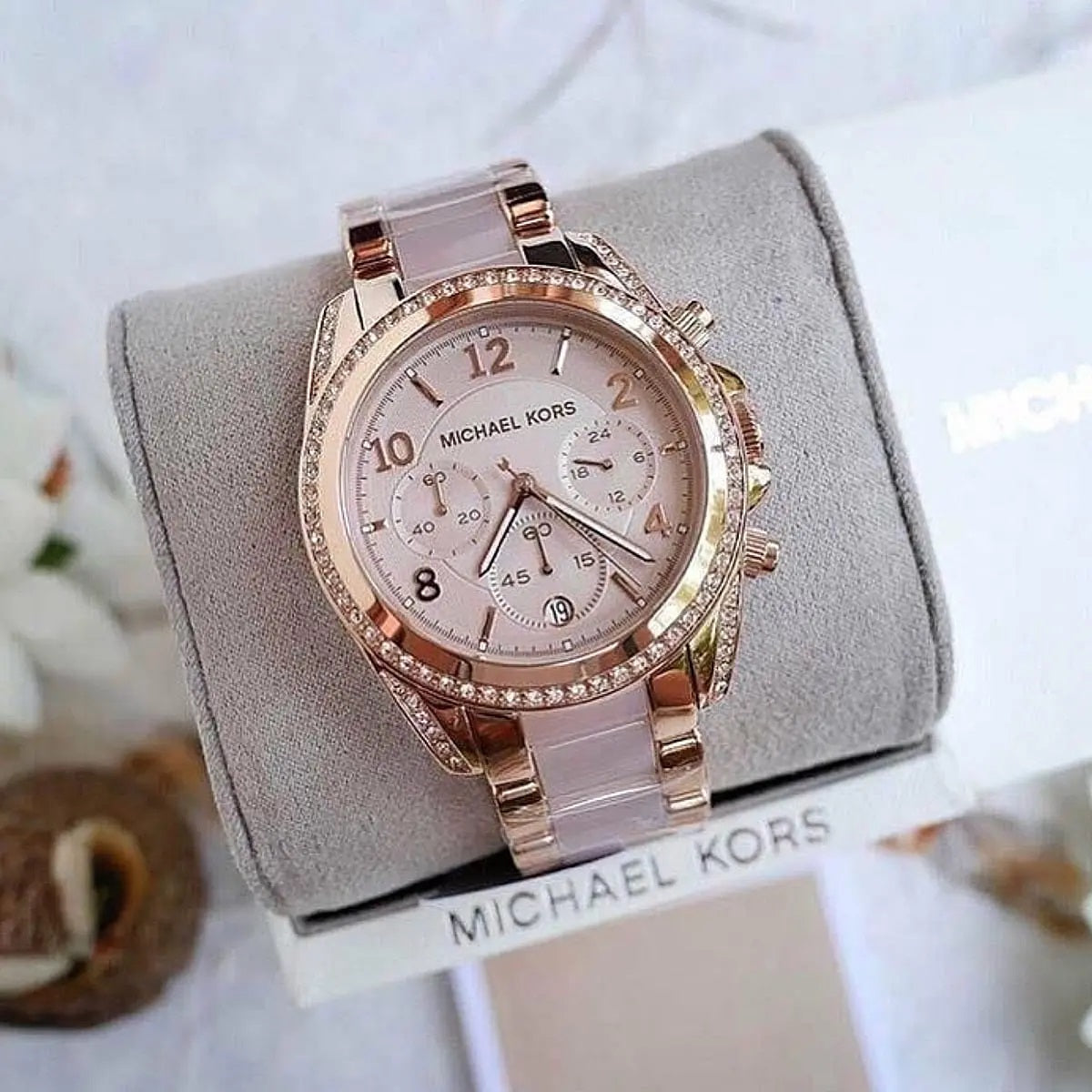Close-up of case and lugs on Michael Kors MK5943 with full rose gold stainless steel finish