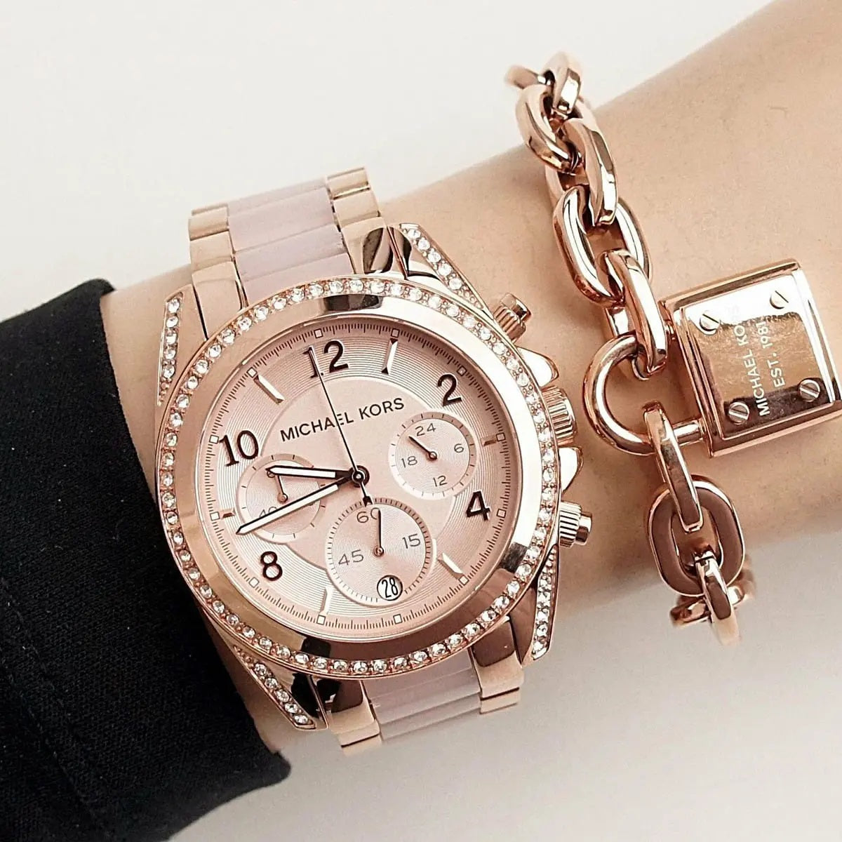 Michael Kors MK5943 women's rose gold watch worn on wrist, showing full case and bracelet