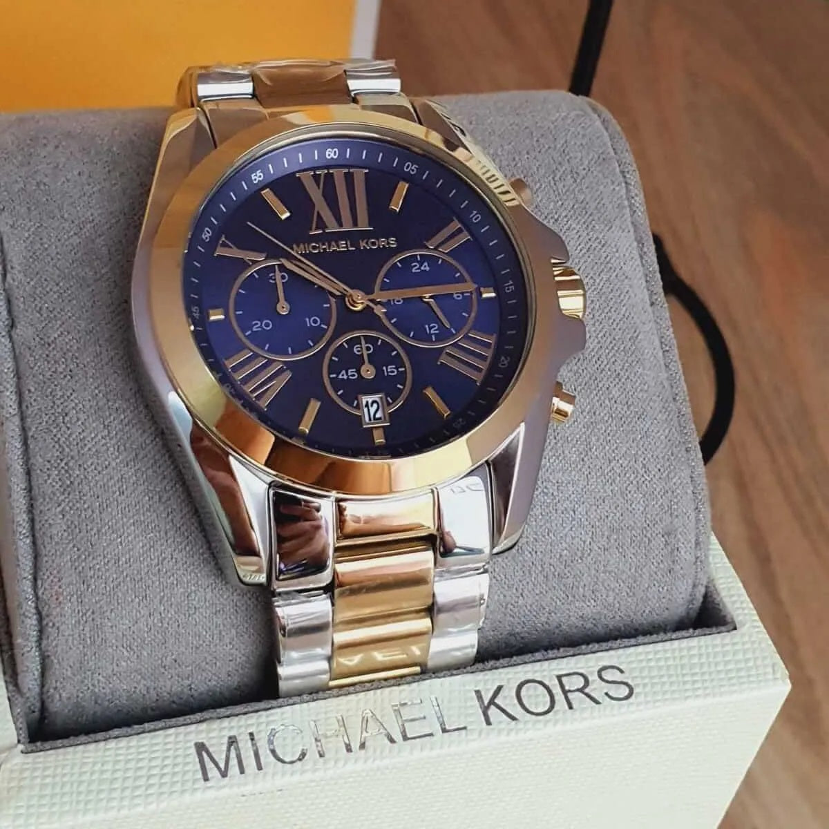 Close-up of case and lugs on Michael Kors MK5976 with two-tone strap and blue dial