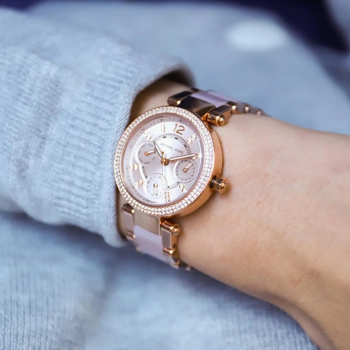 Dial hands and indices detail on Michael Kors MK6110 women's rose gold watch