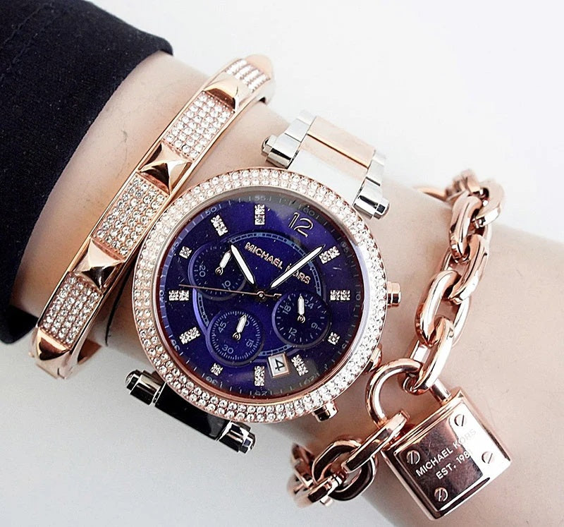 Dial and hands close-up on Michael Kors MK6141 women's watch with blue face