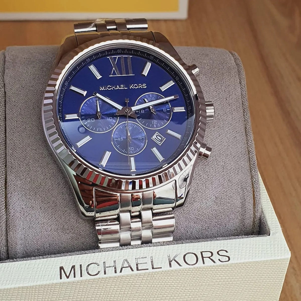 Case and lugs close-up of Michael Kors MK8280 men's stainless steel watch with blue dial