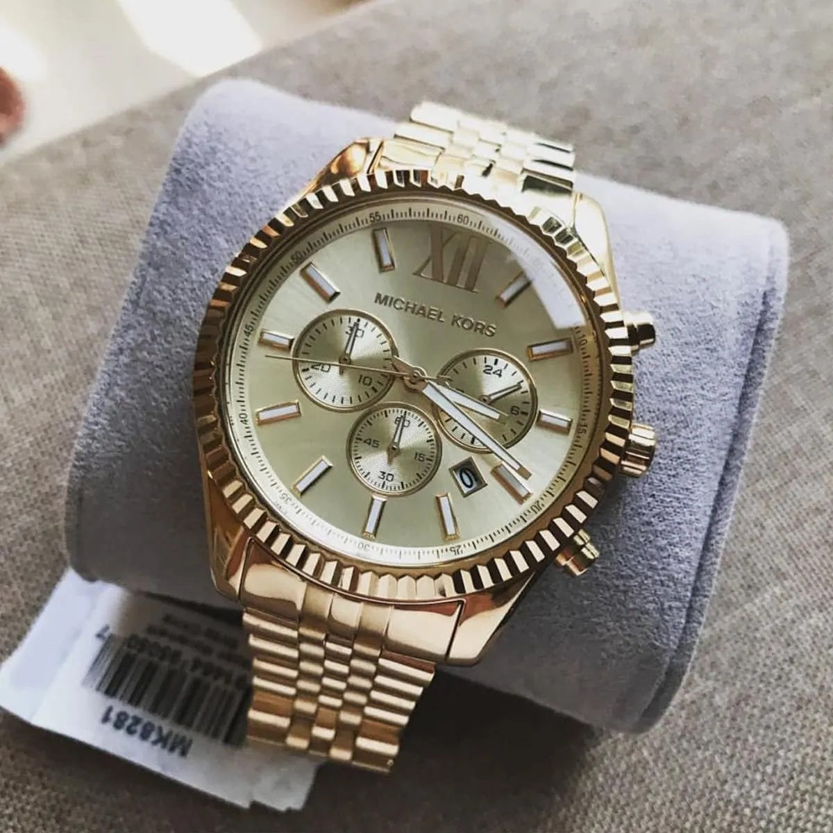 Detail of case and lugs on Michael Kors MK8281 men's gold stainless steel watch