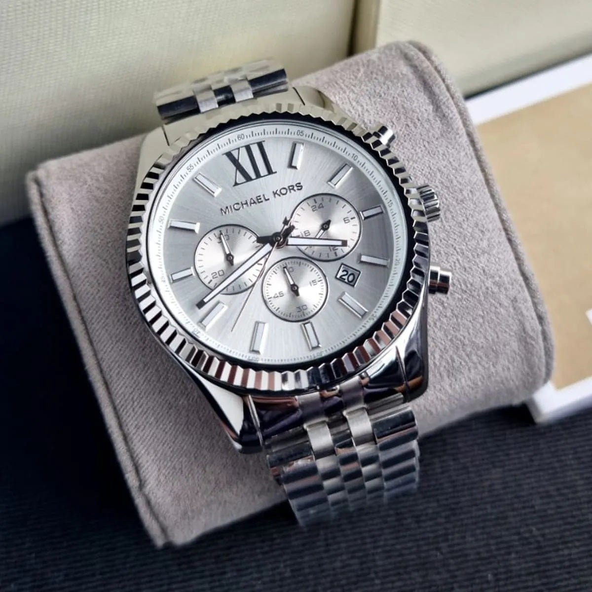 Close-up of case and lugs on Michael Kors MK8405 silver stainless steel watch