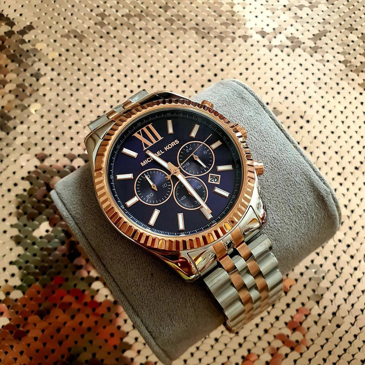Case and lugs detail on Michael Kors MK8412 men's two-tone rose gold and silver watch