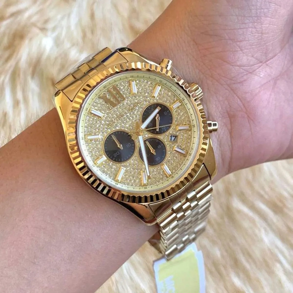 Michael Kors MK8494 men's gold watch with pavé dial worn on wrist