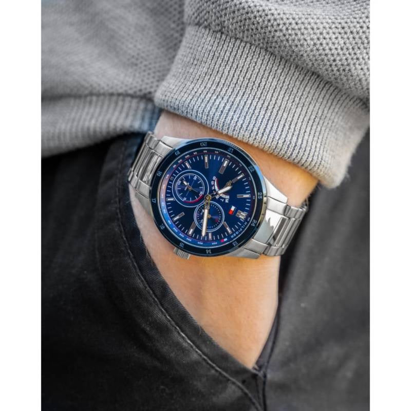 Tommy Hilfiger 1791640 men's watch on wrist in pockets with silver strap and blue dial