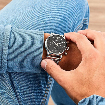 Close wrist view of Emporio Armani AR1811 men’s watch with silver mesh band