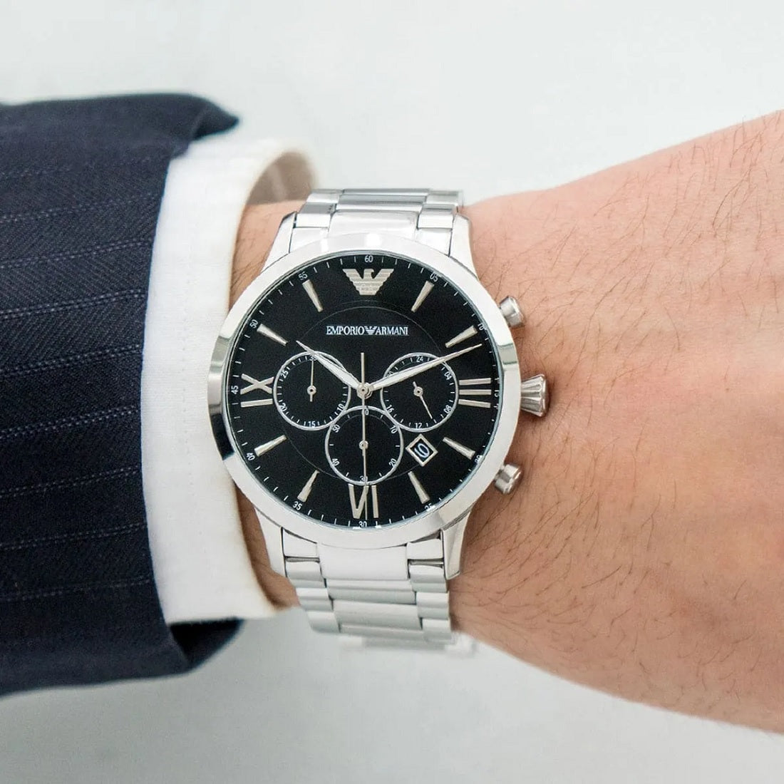 Close-up wrist shot of Emporio Armani AR11208 Giovanni with black chronograph dial