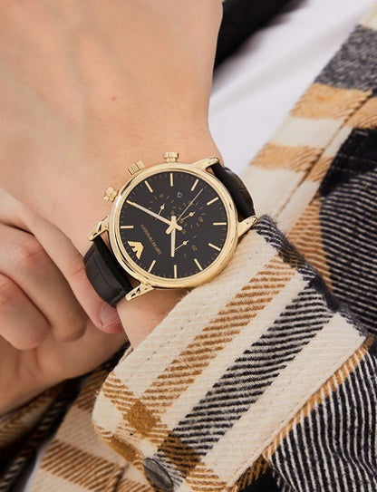 Emporio Armani AR1917 black ceramic watch on men's wrist showing size and fit in natural lighting.