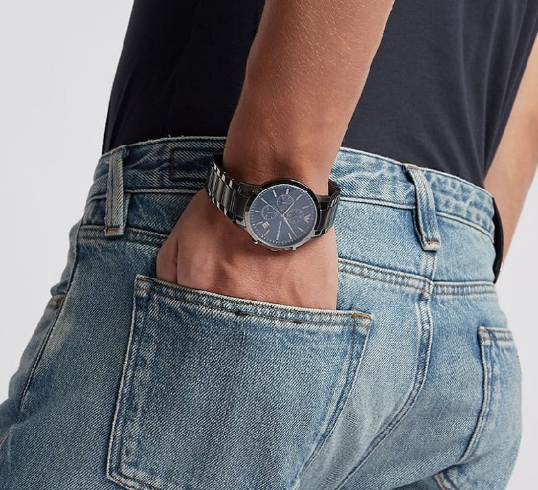 Emporio Armani AR11215 Renato men’s watch on wrist with hand in pocket, showcasing a stylish and casual modern look