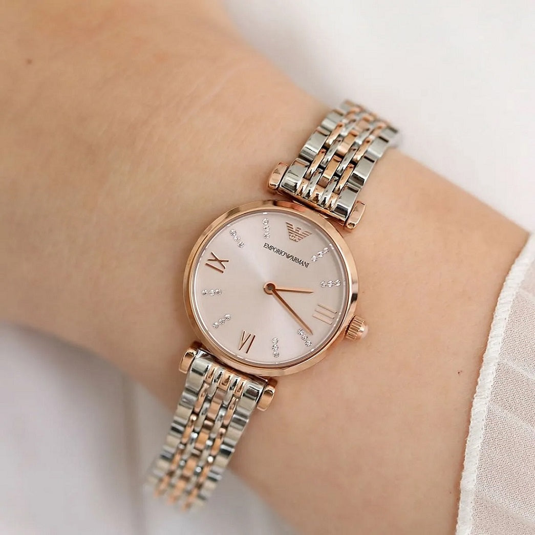 Emporio Armani AR11223 women’s watch worn on wrist showcasing elegant rose gold dial and two-tone bracelet
