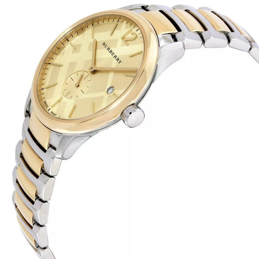 Angled view of the Burberry BU10011 showcasing the gold-tone bezel, textured champagne dial, and two-tone link bracelet.