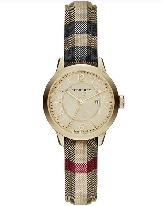 Front view of the Burberry BU10104 The City women's watch featuring a gold-tone case, champagne dial, and signature check fabric strap.