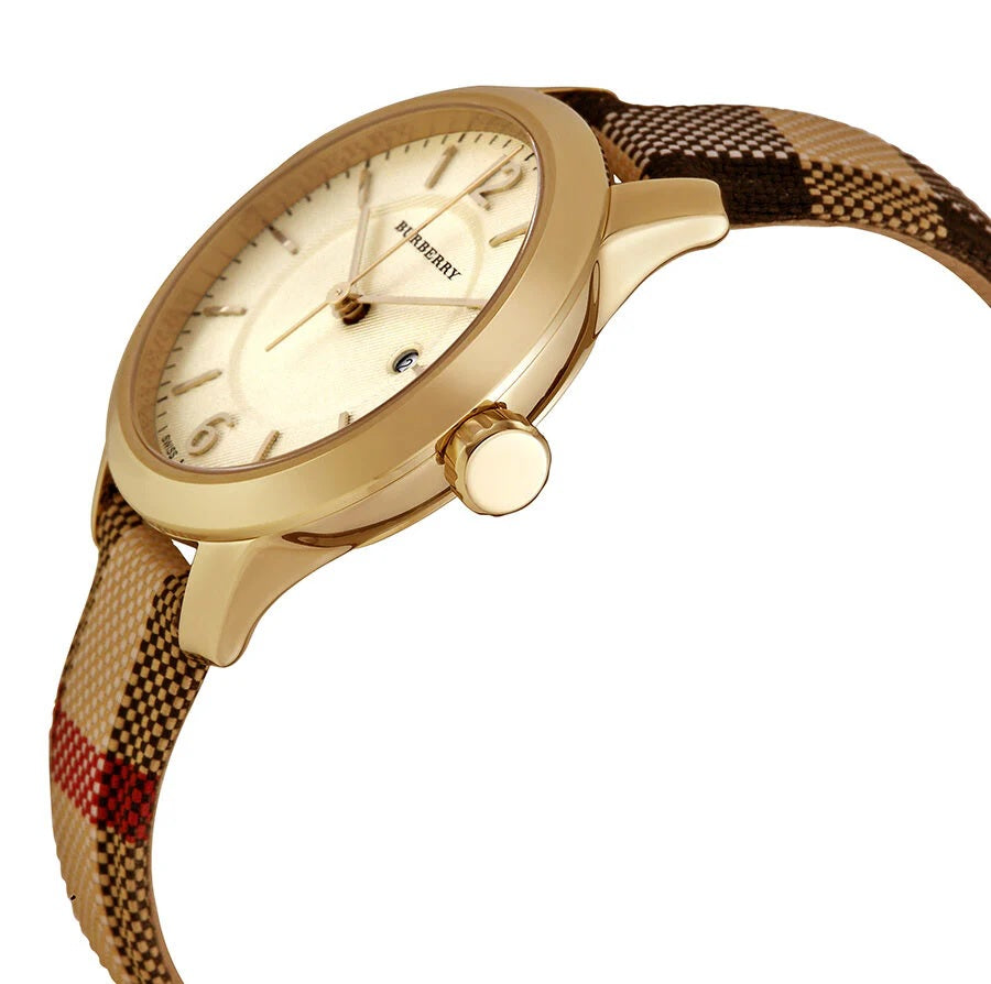 Side profile view of the Burberry BU10104 highlighting the gold-tone case design and crown detail against the check strap.