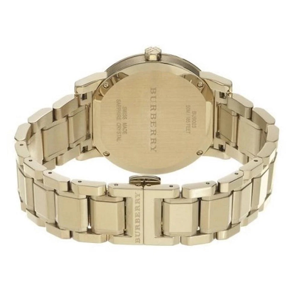 Rear view of the Burberry BU9003 highlighting the closed gold-tone stainless steel butterfly deployment clasp and case back.