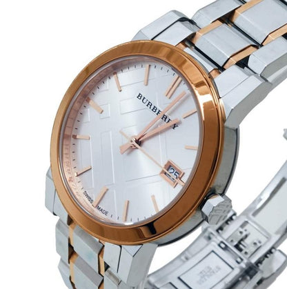 Close-up of the silver dial on the Burberry BU9105 watch, showing the rose gold accents.