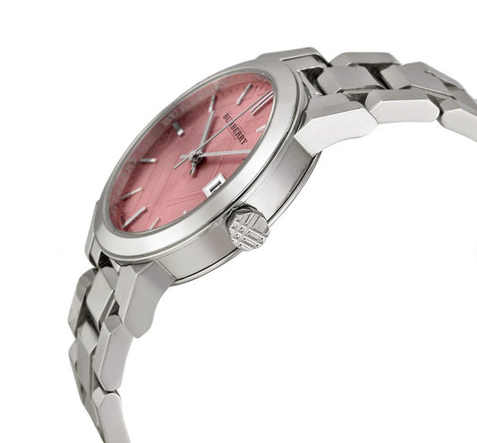 Angled view of the Burberry BU9124 showcasing the metallic pink textured dial, silver-tone case, and stainless steel link bracelet.