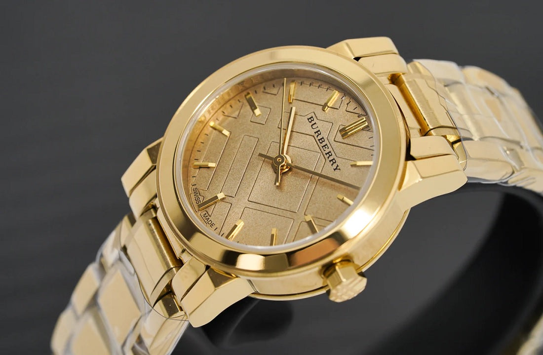 Close-up of the gold dial on Burberry BU9227 The City women’s watch with stainless steel gold strap