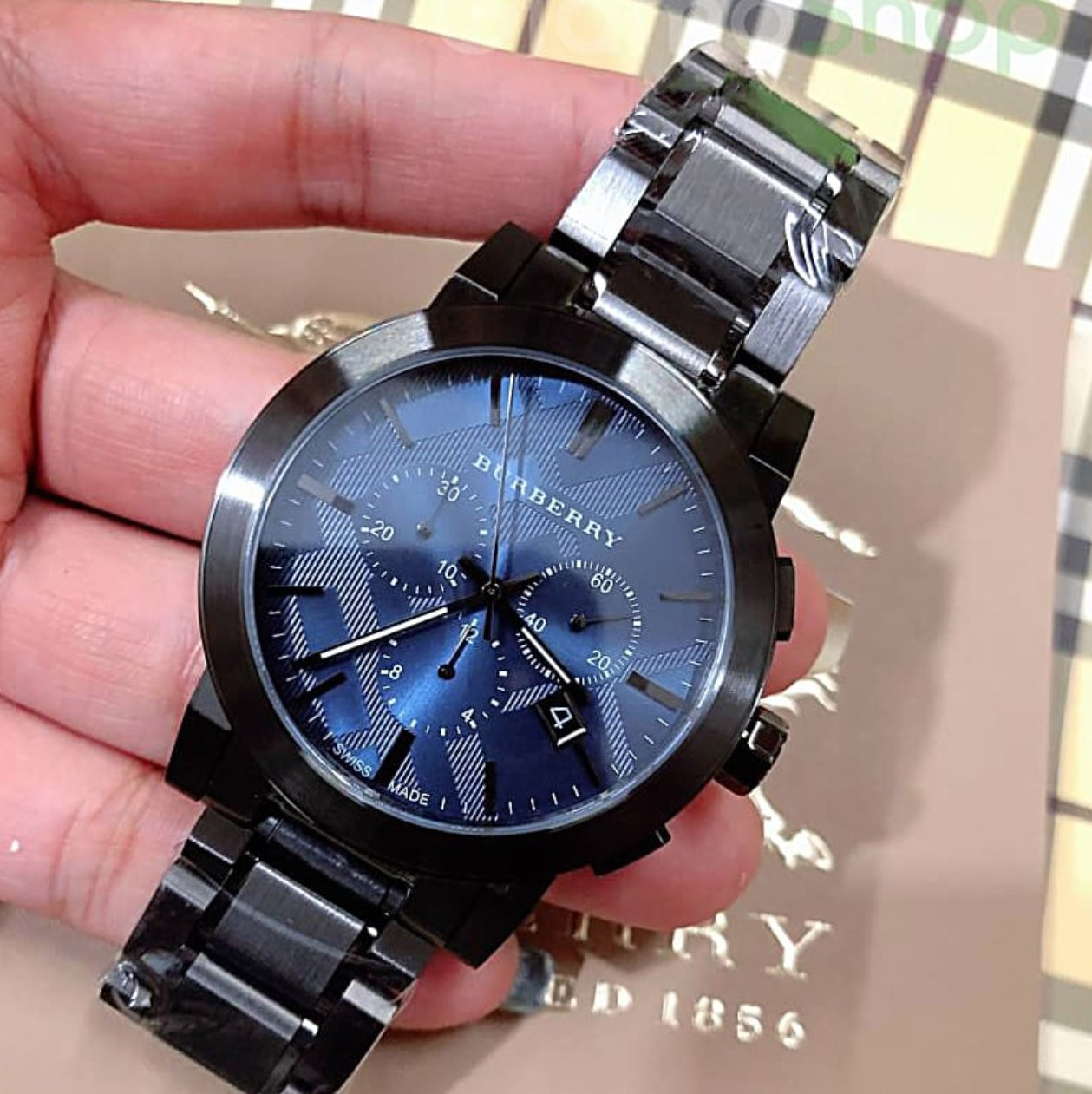 Front-facing view of Burberry BU9365 The City men’s watch in silver and blue
