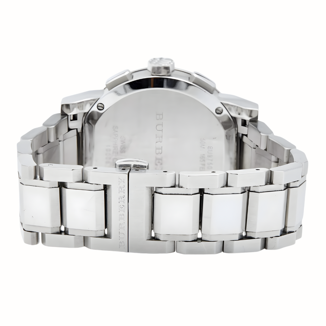 Close-up of a silver watch with a metal band on a white background