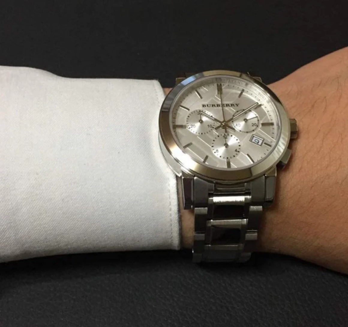 Burberry BU9750 unisex watch worn on wrist with silver strap and dial