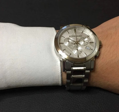 Burberry BU9750 unisex watch worn on wrist with silver strap and dial