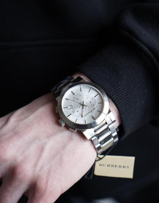 Burberry men’s chronograph silver watch worn on wrist